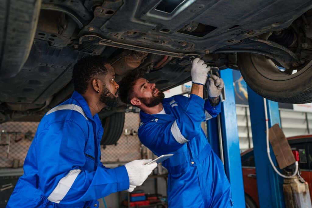 team auto mechanic in blue uniform are repair and 2024 05 13 05 35 07 utc No.1 Best Services of Irving Auto Repair Center- CarMex Inc.